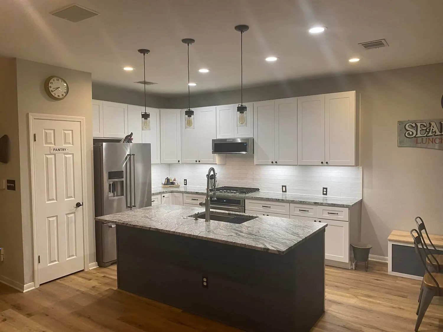 Kitchen after remodel with island and finished cabinets