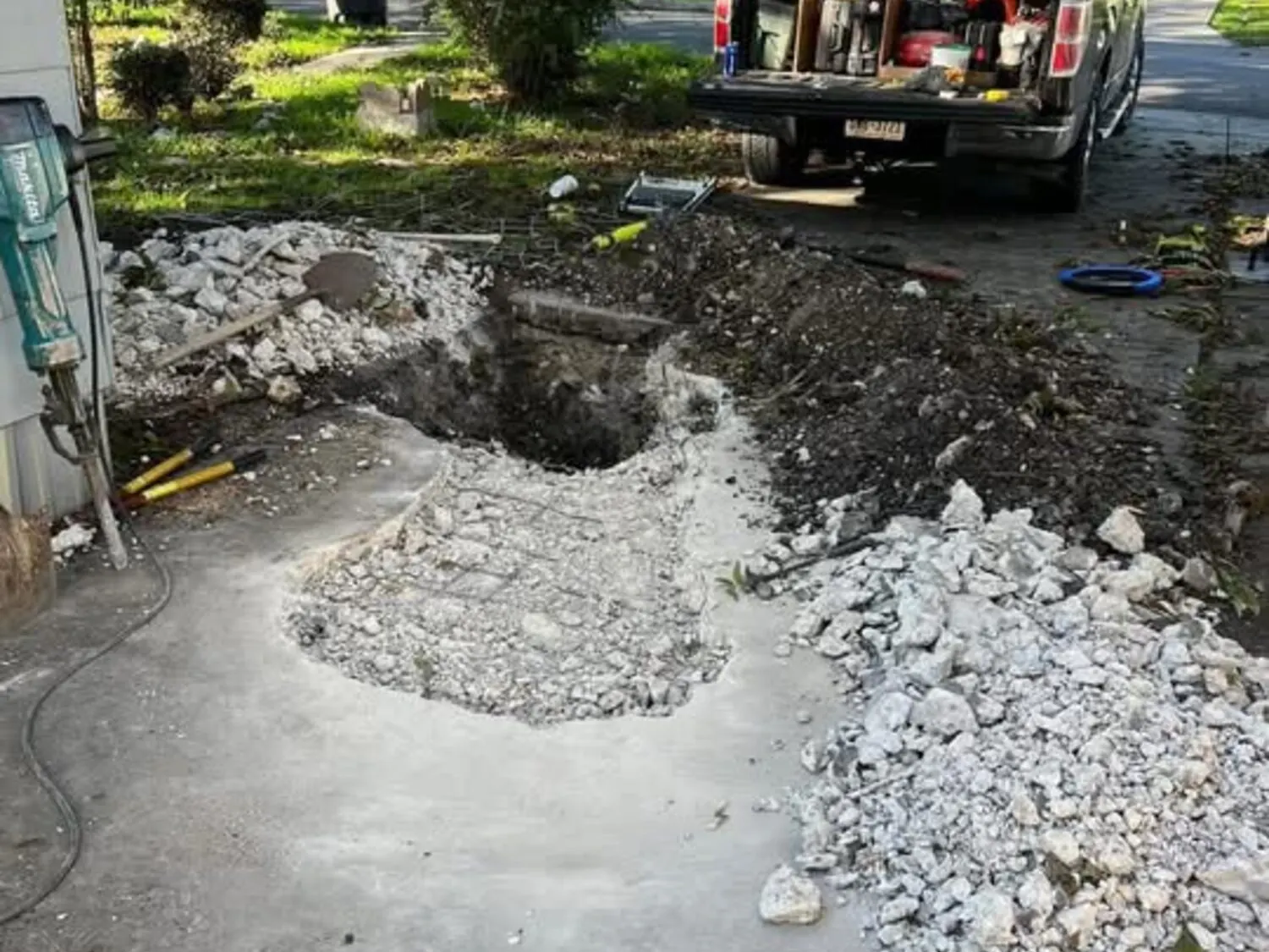 Hand-dug sewer trench during excavation